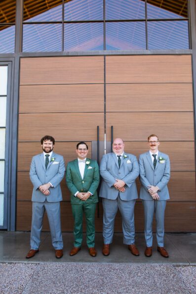 Groom and groomsmen together at a Phoenix desert intimate wedding by Arizona wedding photographer Juniper and Co Photography.