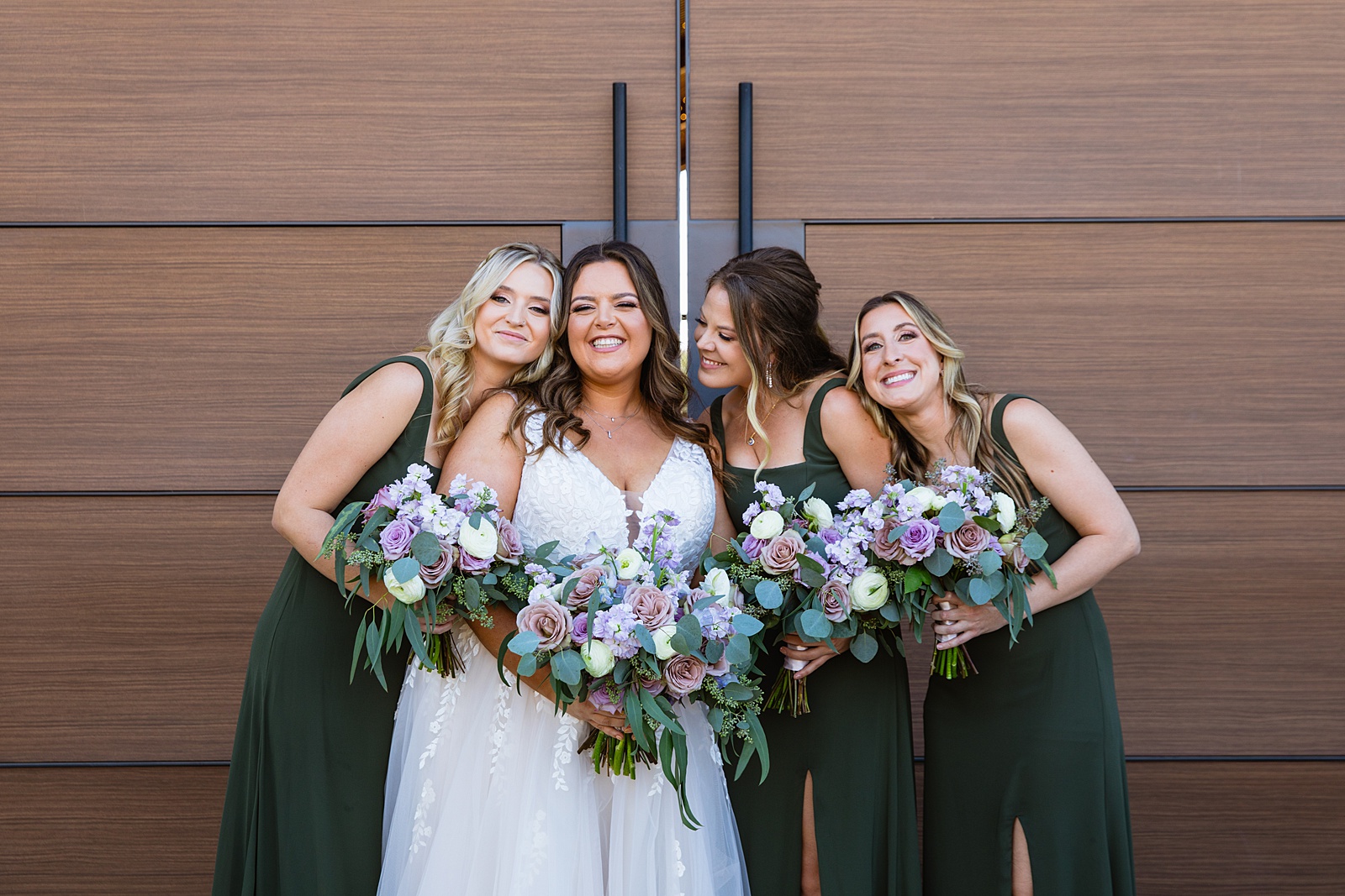 Bride and bridesmaids laughing together at Phoenix desert intimate wedding by Phoenix wedding photographer Juniper and Co Photography.