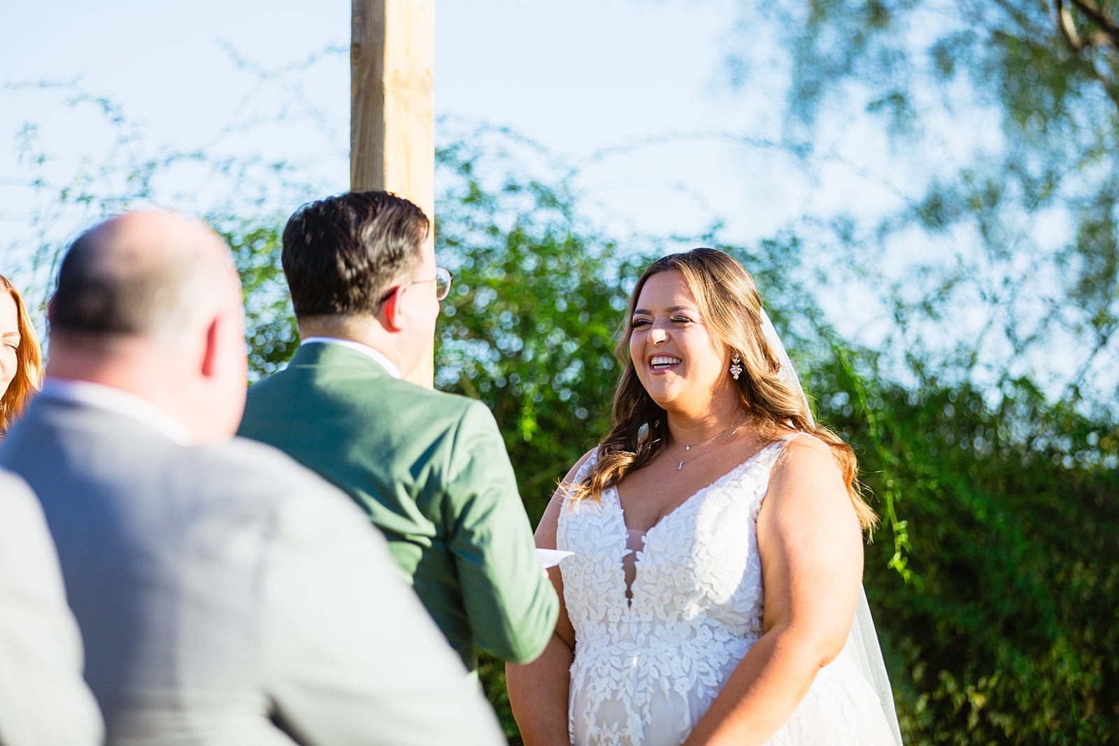 Bride looking at her groom during their wedding ceremony at a Phoenix desert intimate wedding by Phoenix wedding photographer Juniper and Co Photography.