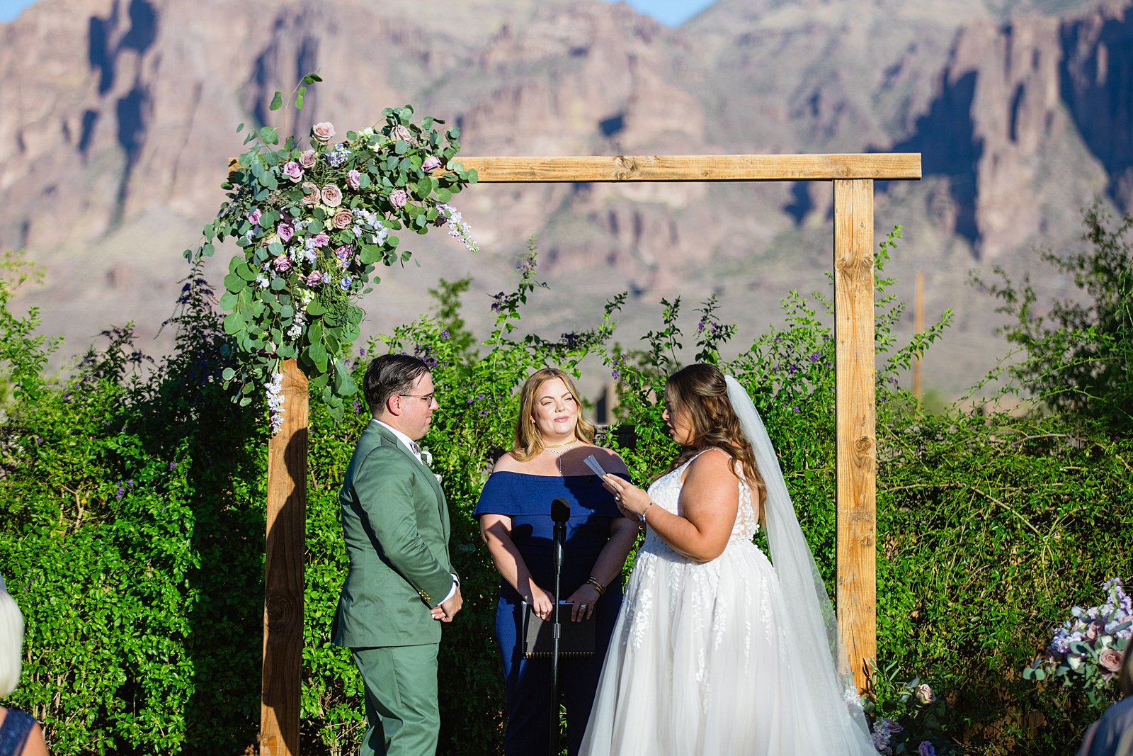 Bride & Groom exchange vows during their a Phoenix desert intimate wedding ceremony by Phoenix wedding photographer Juniper and Co Photography.