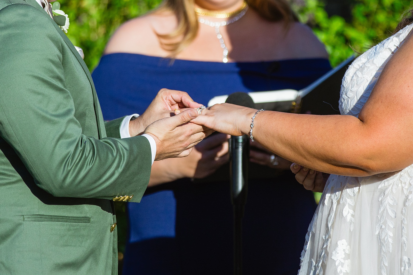 Bride & Groom exchange rings during their wedding ceremony at a Phoenix desert intimate wedding by Phoenix wedding photographer Juniper and Co Photography.
