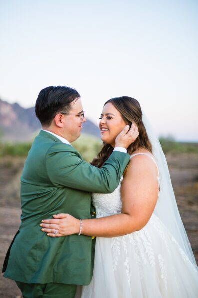 Bride & Groom looking at each other during their a Phoenix desert intimate wedding by Phoenix wedding photographer Juniper and Co Photography.