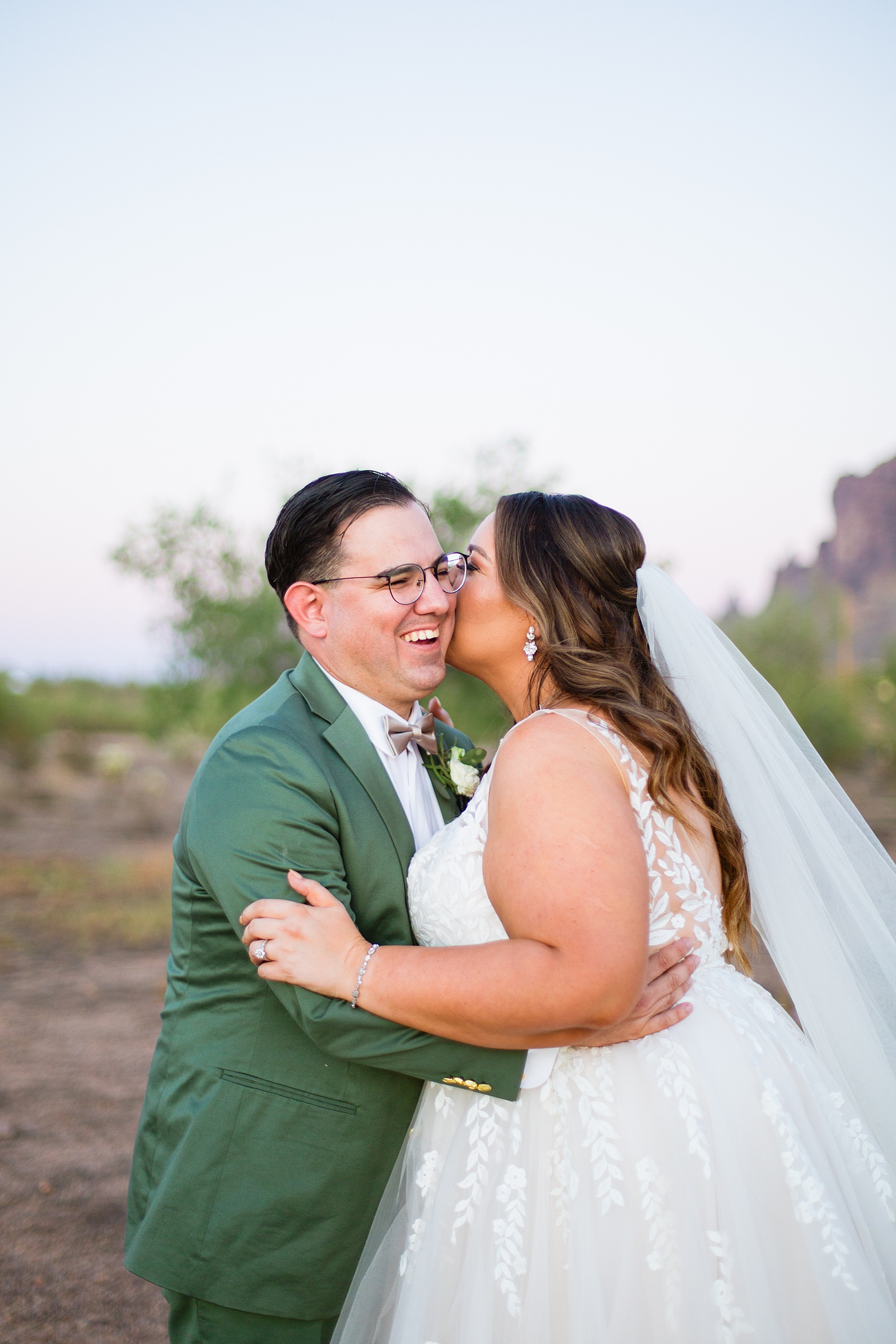 Bride & Groom laughing together during their a Phoenix desert intimate wedding by Phoenix wedding photographer Juniper and Co Photography.