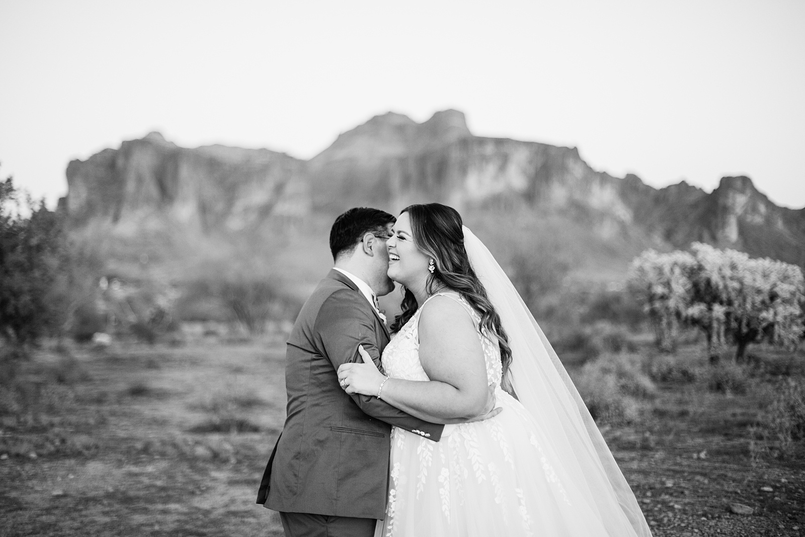 Bride & Groom laughing together during their a Phoenix desert intimate wedding by Arizona wedding photographer Juniper and Co Photography.