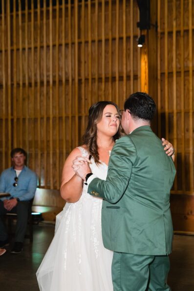 Bride & Groom sharing first dance at their Phoenix desert intimate wedding reception by Arizona wedding photographer Juniper and Co Photography.