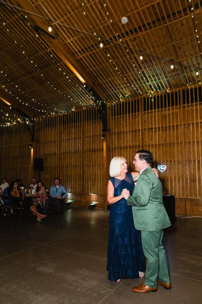 Groom dancing with his mother at a Phoenix desert intimate wedding reception by Phoenix wedding photographer Juniper and Co Photography.