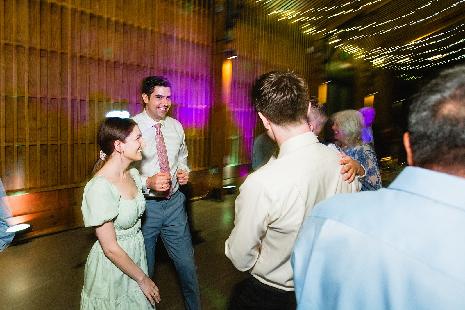 Guests dancing together at a Phoenix desert intimate wedding reception by Phoenix wedding photographer Juniper and Co Photography.