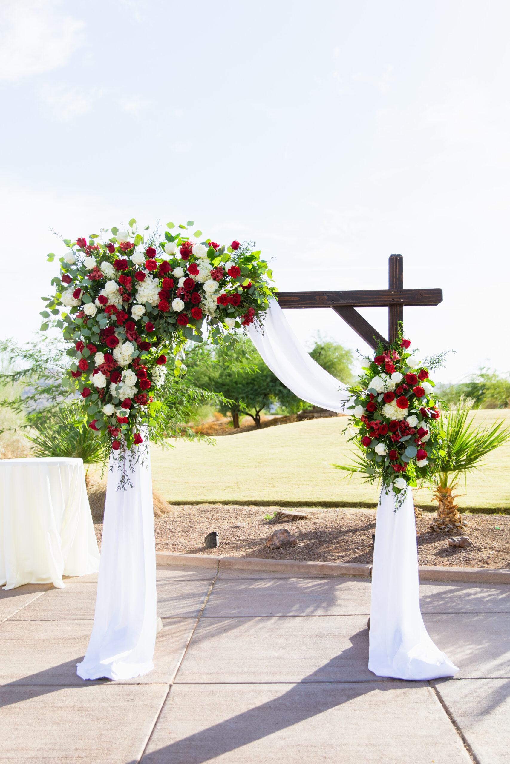 Wedding ceremony arch at intimate desert by Phoenix wedding photographer Juniper and Co Photography.