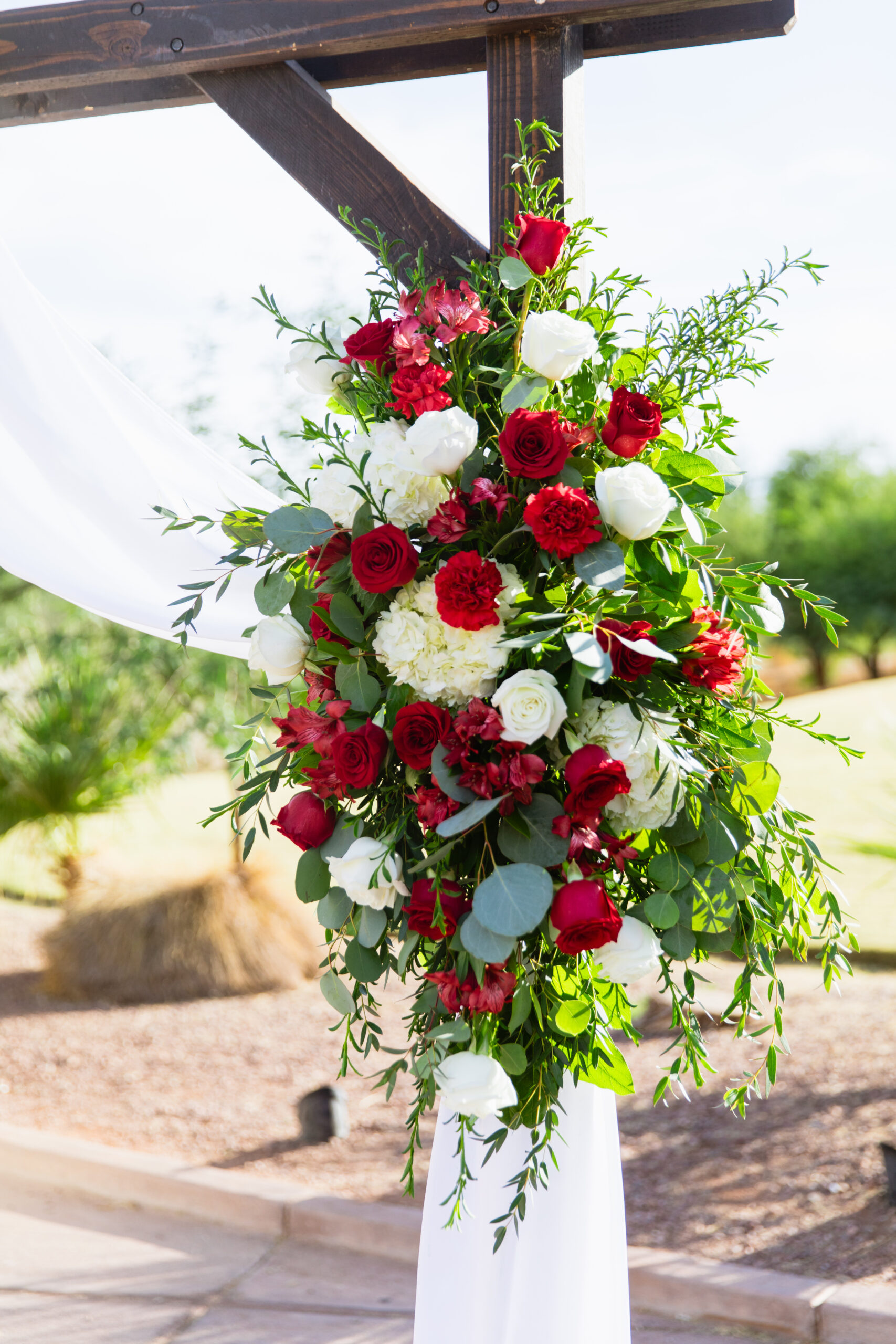Wedding ceremony detail of flowers at intimate desert by Phoenix wedding photographer Juniper and Co Photography.