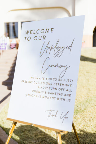 Wedding ceremony welcome sign at intimate desert by Phoenix wedding photographer Juniper and Co Photography.