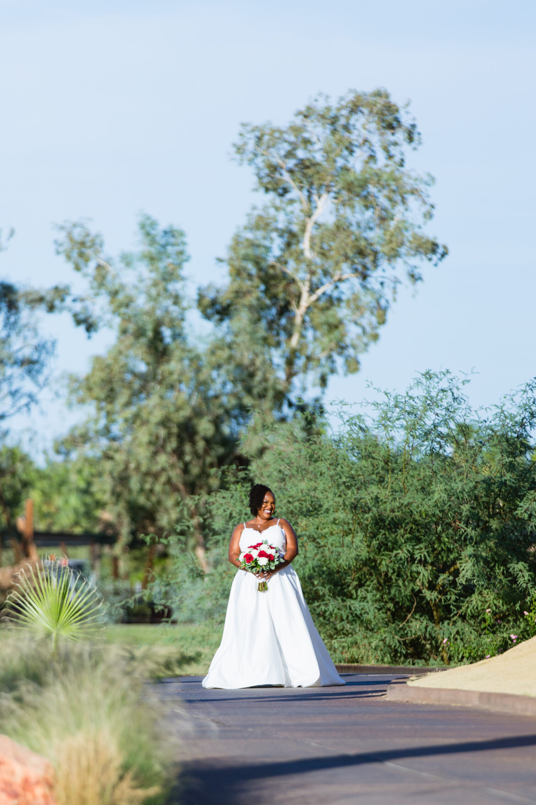 Bride walking down aisle during intimate desert wedding ceremony by Phoenix wedding photographer Juniper and Co Photography.
