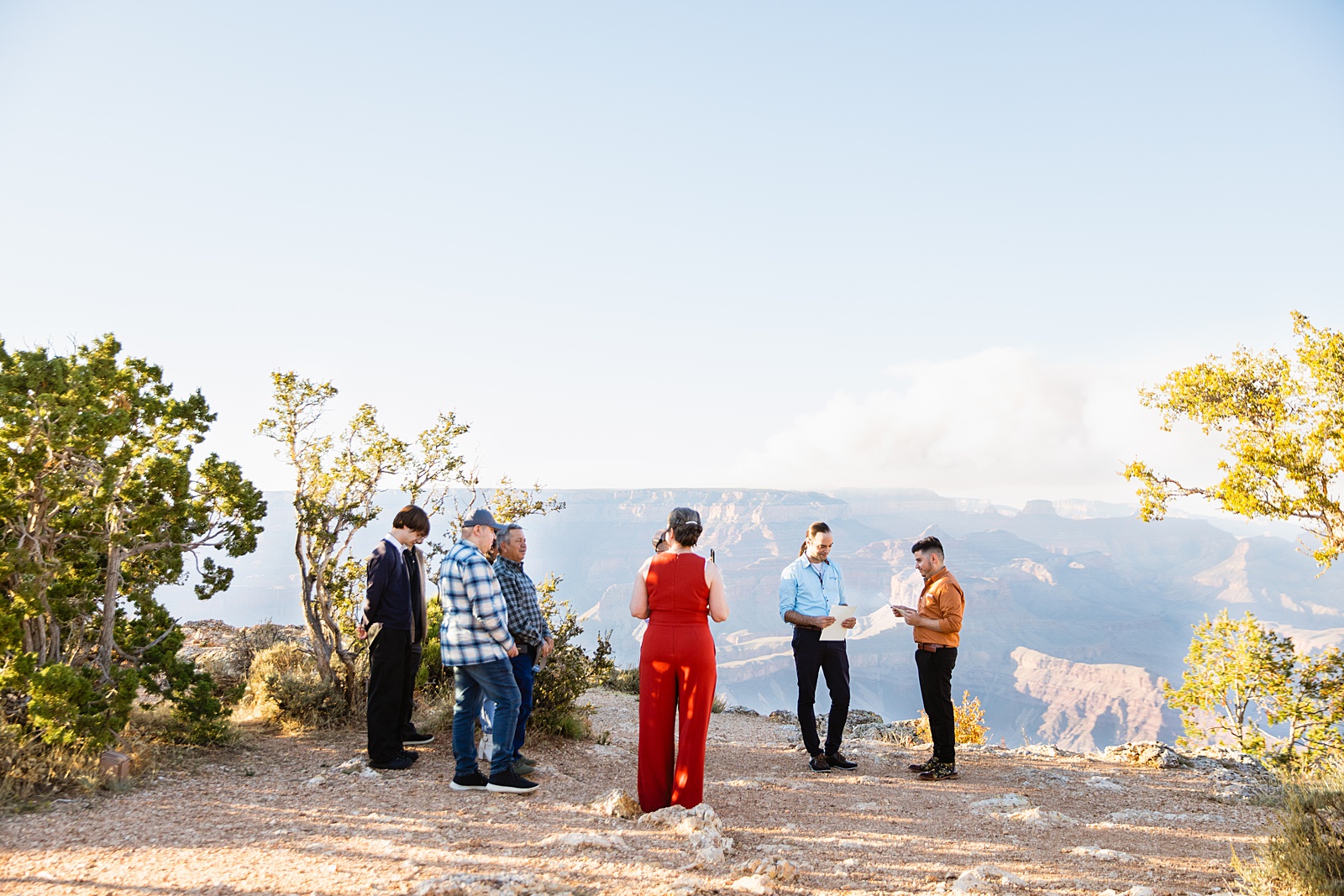 Officiant at wedding ceremony at Grand Canyon by Arizona elopement photographer Juniper and Co Photography.