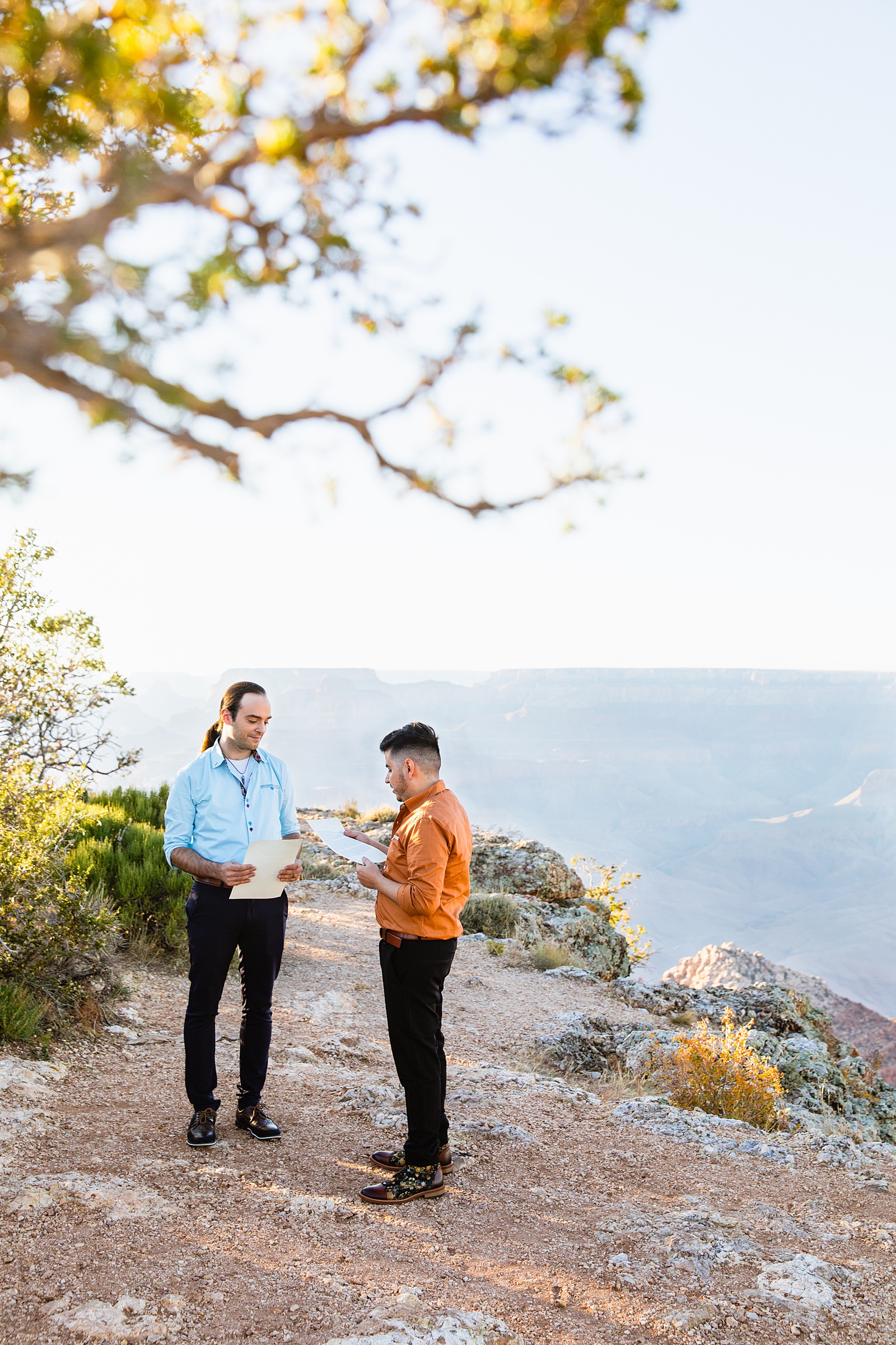 LGBTQ couple exchange vows during their wedding ceremony at Grand Canyon by Arizona elopement photographer Juniper and Co Photography.