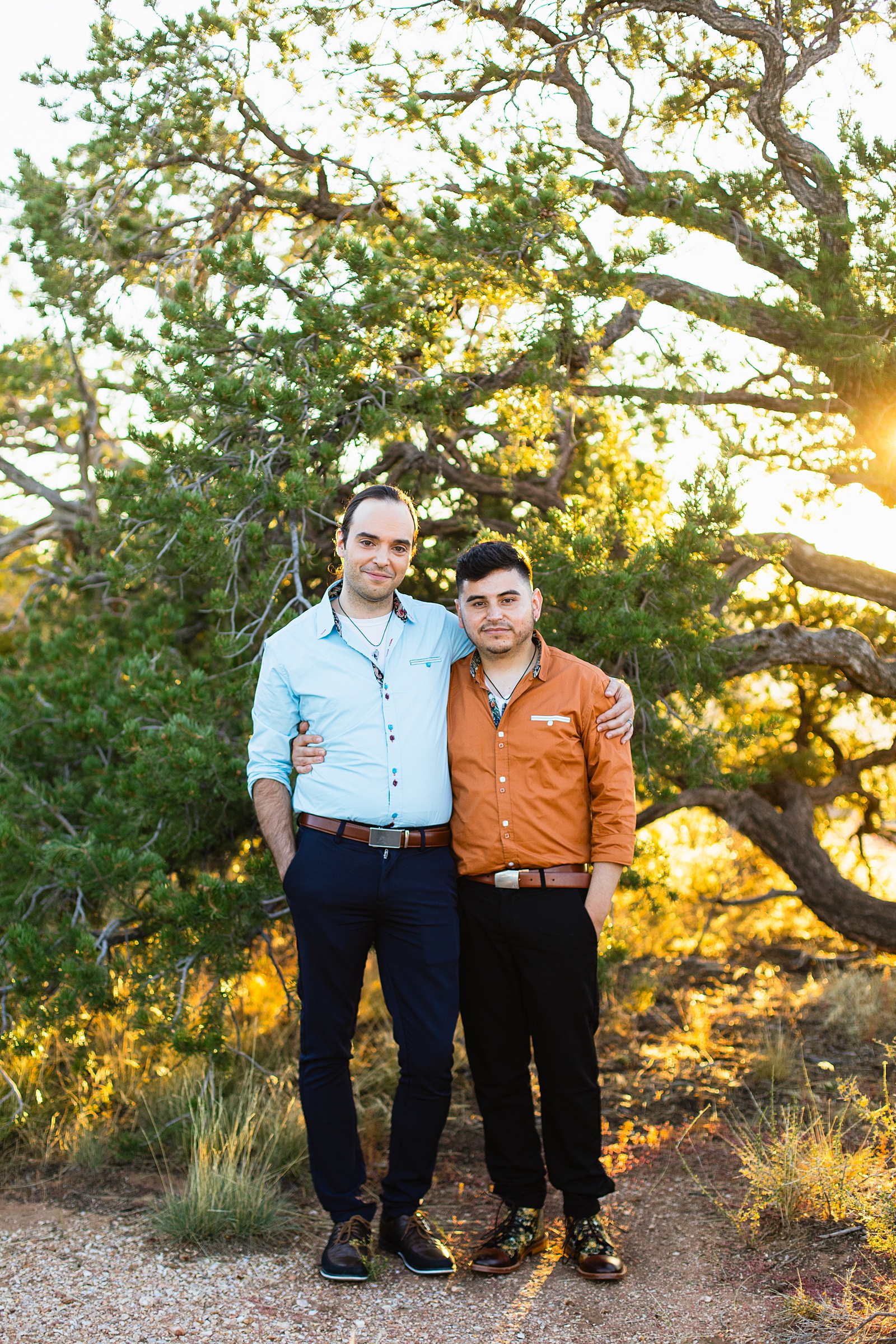 LGBTQ couple pose during their Grand Canyon elopement by Arizona elopement photographer Juniper and Co Photography.