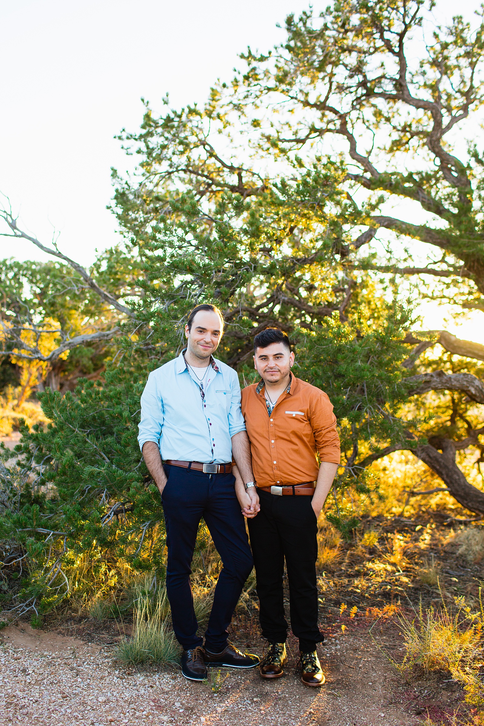 LGBTQ couple pose for their Grand Canyon elopement by Flagstaff elopement photographer Juniper and Co Photography.