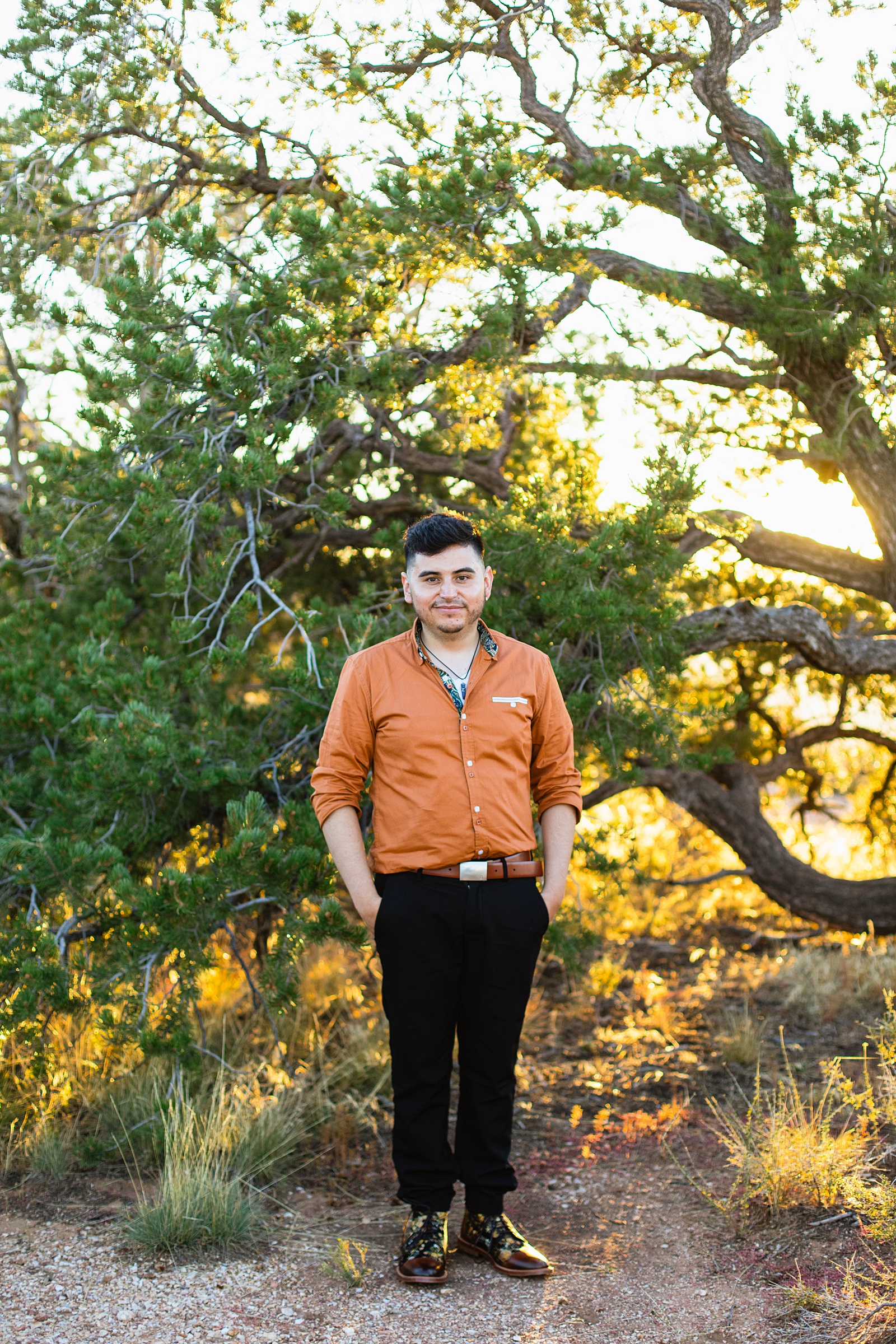 Groom's rust colored shirt and wedding day outfit for his Grand Canyon elopement by Juniper and Co Photography.