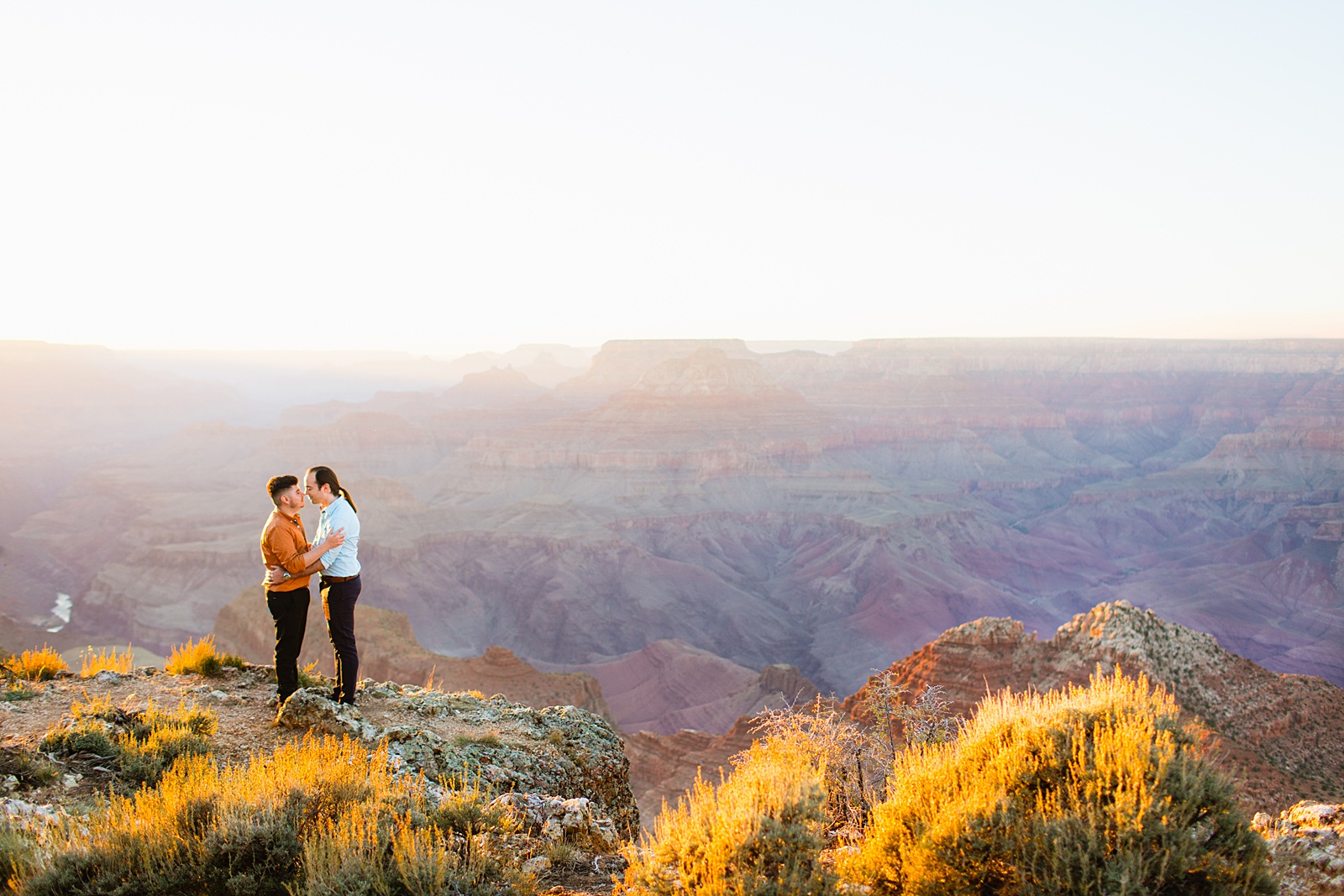 LGBTQ couple share an intimate moment during their Grand Canyon elopement by Flagstaff elopement photographer Juniper and Co Photography.