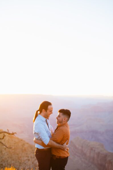 LGBTQ couple laughing together during their Grand Canyon elopement by Flagstaff elopement photographer Juniper and Co Photography.
