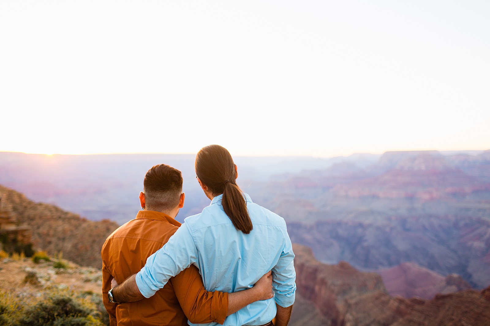 LGBTQ couple share an intimate moment at their Grand Canyon elopement by Arizona elopement photographer Juniper and Co Photography.