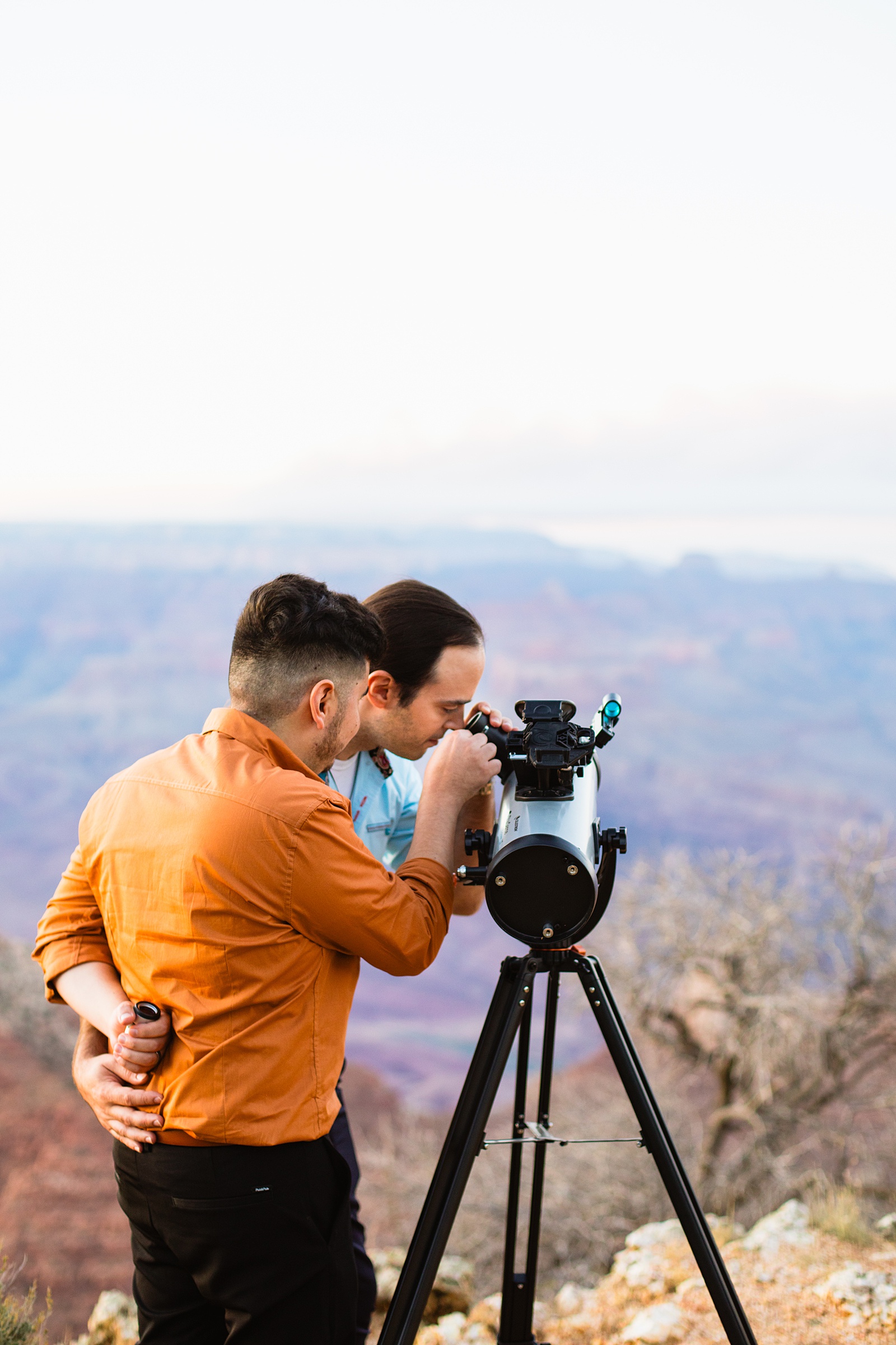 LGBTQ couple stargazing during their Grand Canyon elopement by Flagstaff elopement photographer Juniper and Co Photography.