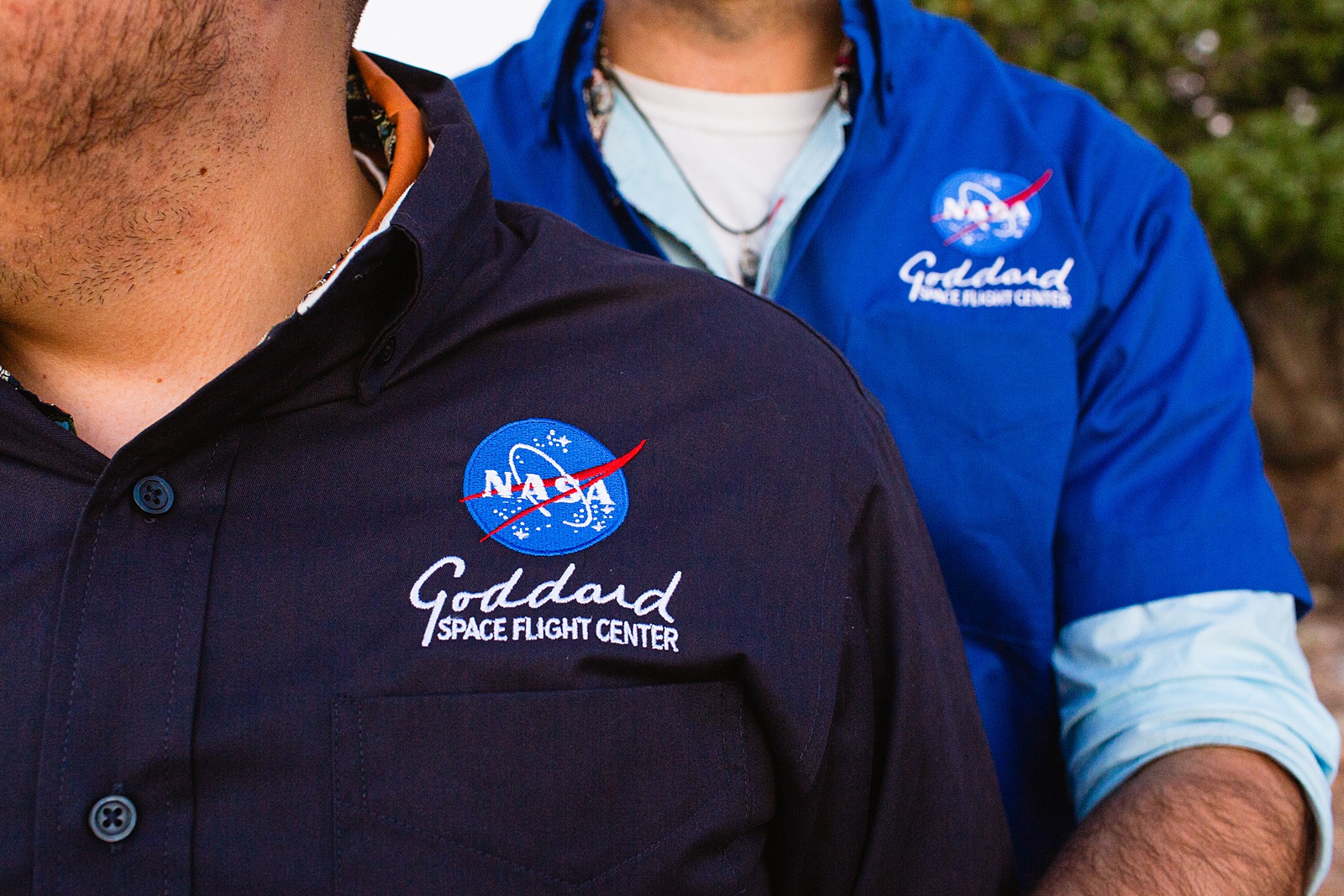 Groom in NASA shirt while stargazing during their Grand Canyon elopement by Flagstaff elopement photographer Juniper and Co Photography.