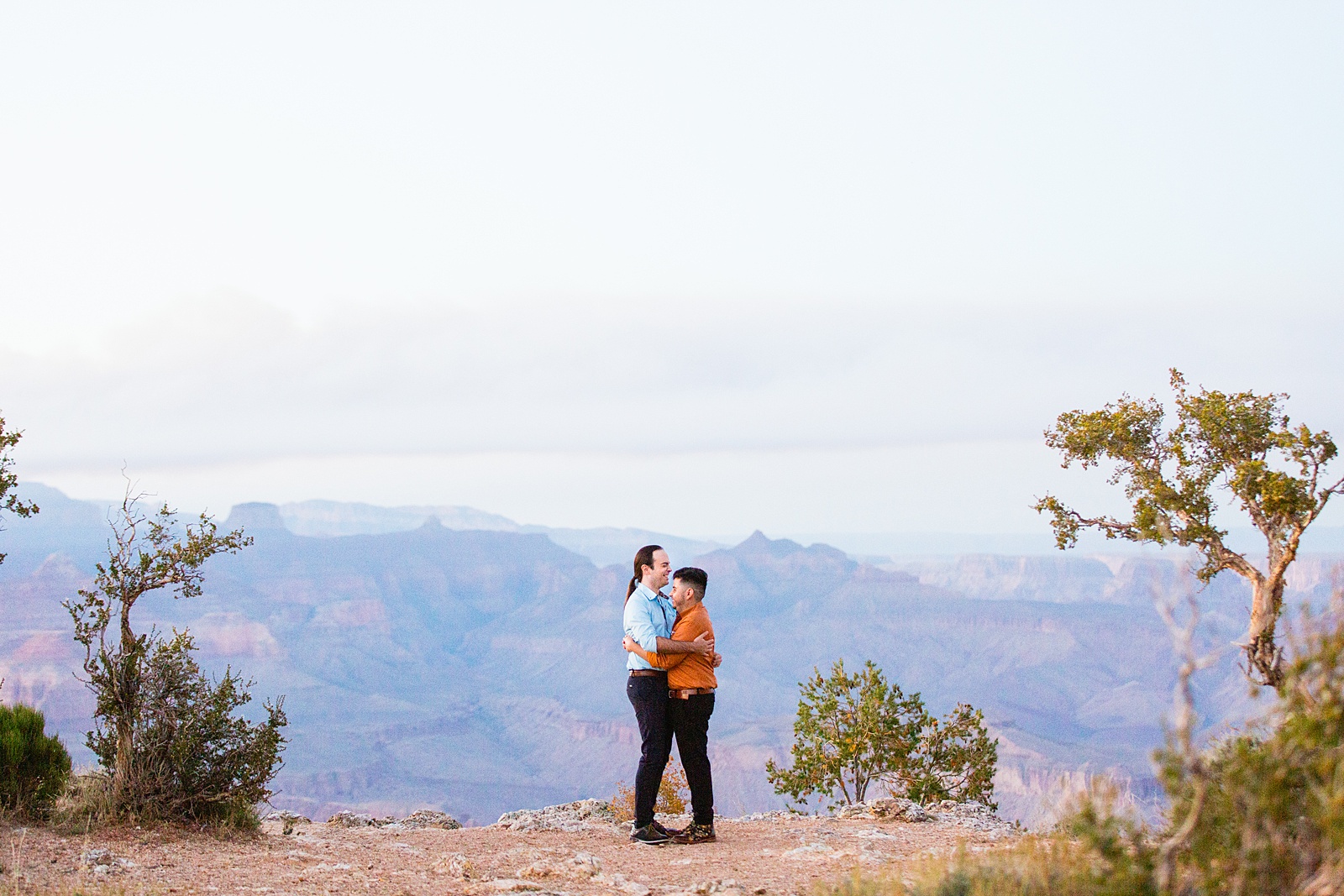 LGBTQ couple share an intimate moment during their Grand Canyon elopement by Flagstaff elopement photographer Juniper and Co Photography.