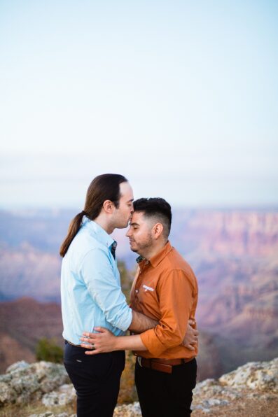 LGBTQ couple share a kiss during their Grand Canyon elopement by Flagstaff elopement photographer Juniper and Co Photography.