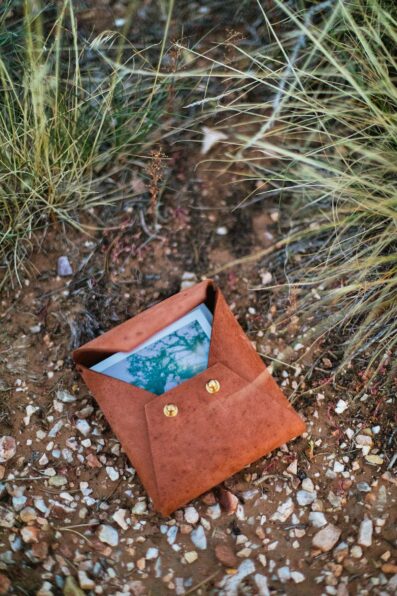 Polaroid leather photo case detail at Grand Canyon elopement by Flagstaff elopement photographer Juniper and Co Photography.
