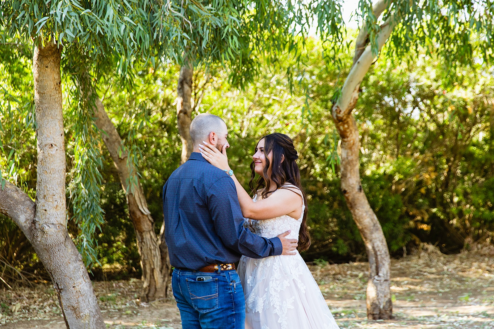 Bride & Groom share an intimate moment during their first look at intimate backyard wedding by Phoenix wedding photographer Juniper and Co Photography.