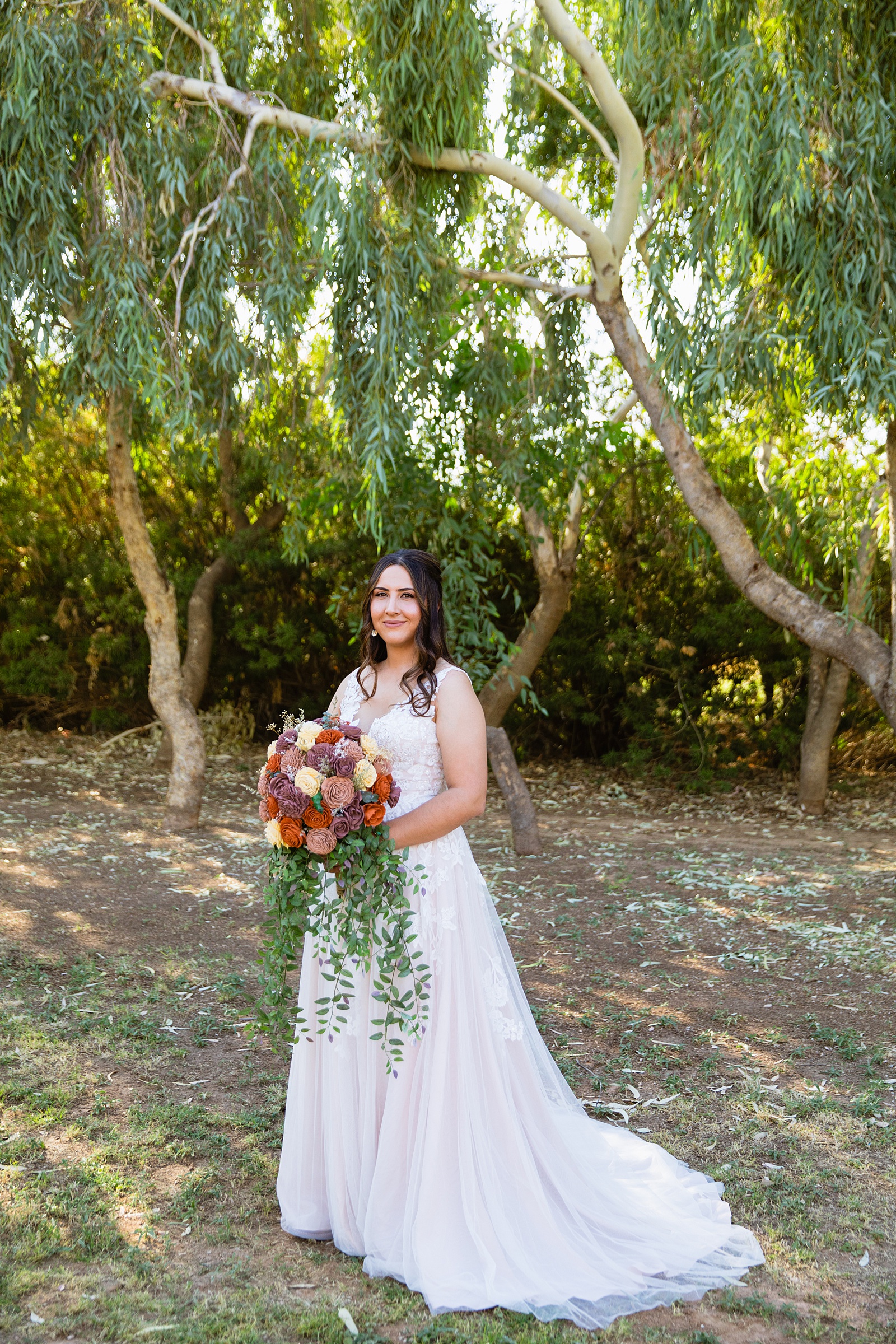 Bride's deep v lace wedding dress for her intimate backyard wedding wedding by Juniper and Co Photography.