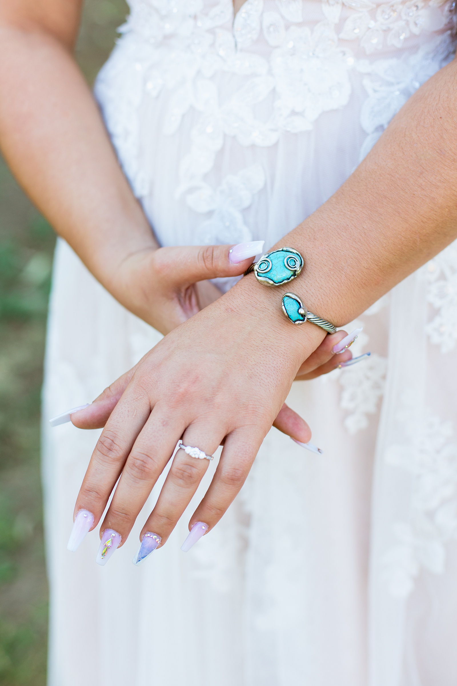 Bride's wedding day details of turquoise bracelet and bridal acrylic nails by Juniper and Co Photography.