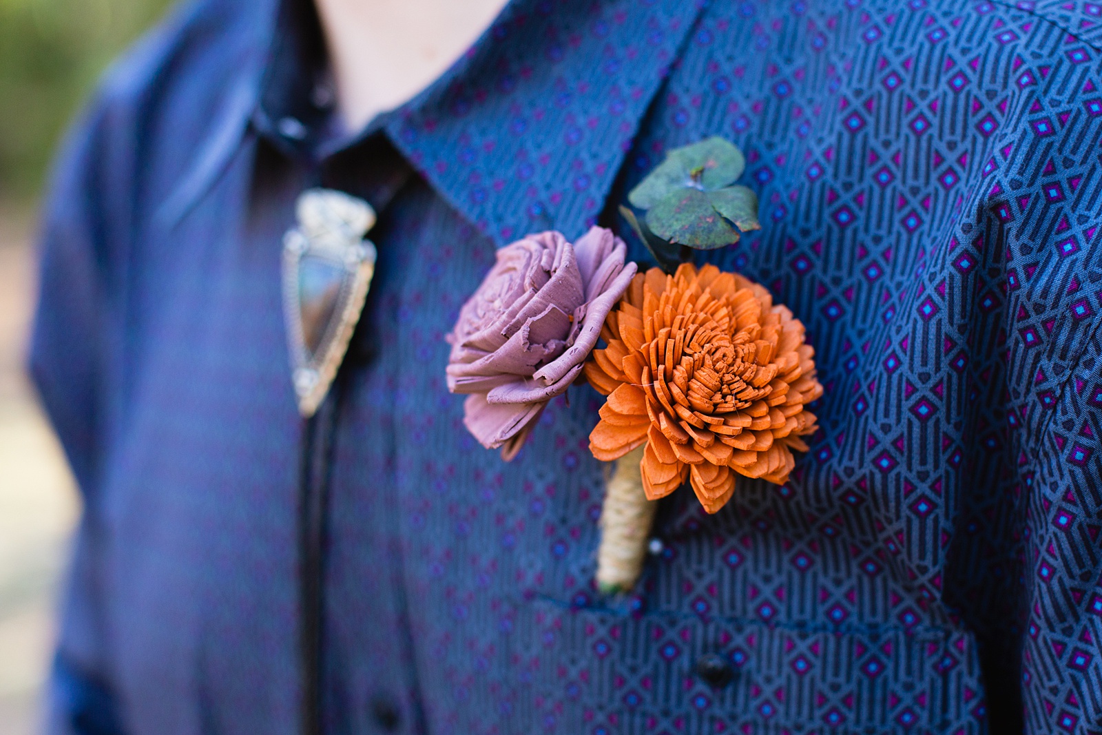 Groom's intricate and bold paper flowers boutonniere by Juniper and Co Photography.