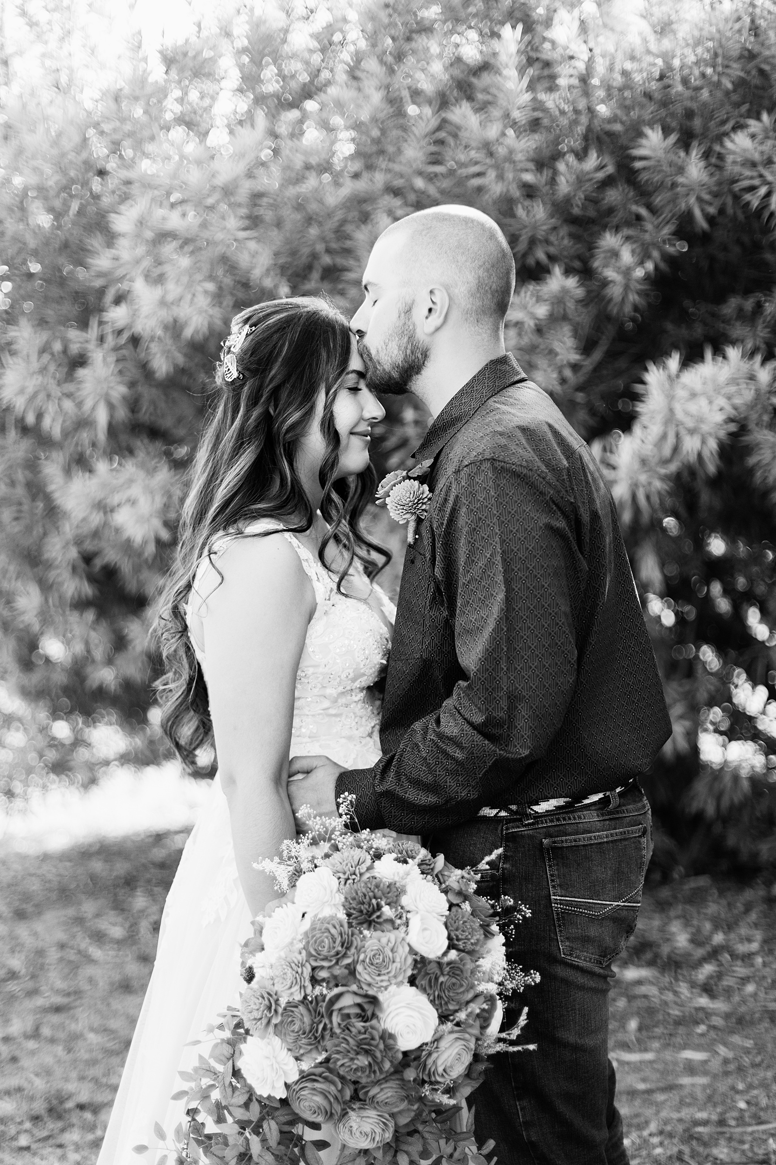 Bride & Groom share an intimate moment at their intimate backyard wedding by Arizona wedding photographer Juniper and Co Photography.