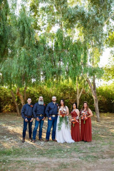Bridal party together at a intimate backyard wedding by Arizona wedding photographer Juniper and Co Photography.