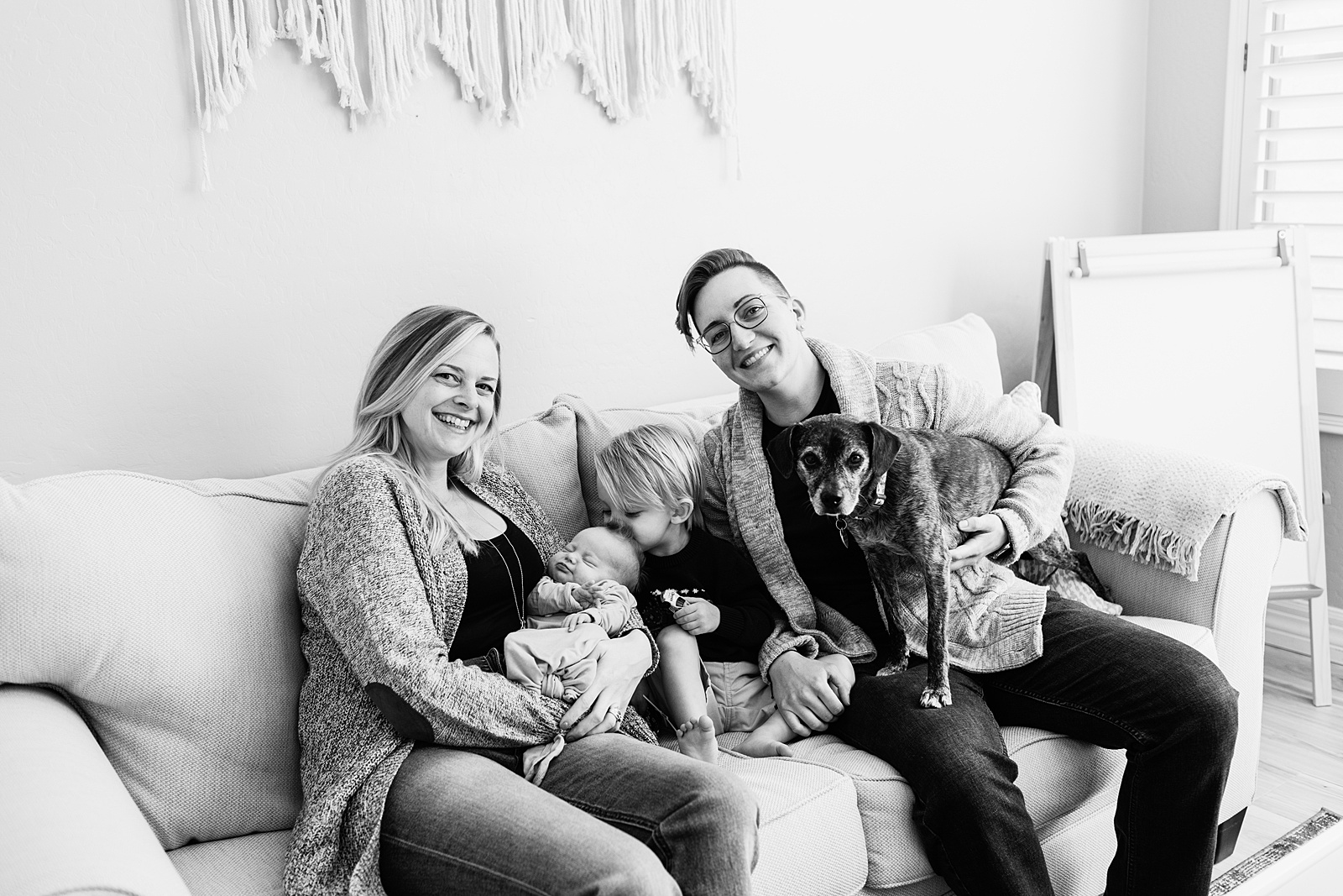 Parents pose with their children during Phoenix In-Home Newborn session by Arizona wedding photographer Juniper and Co Photography.