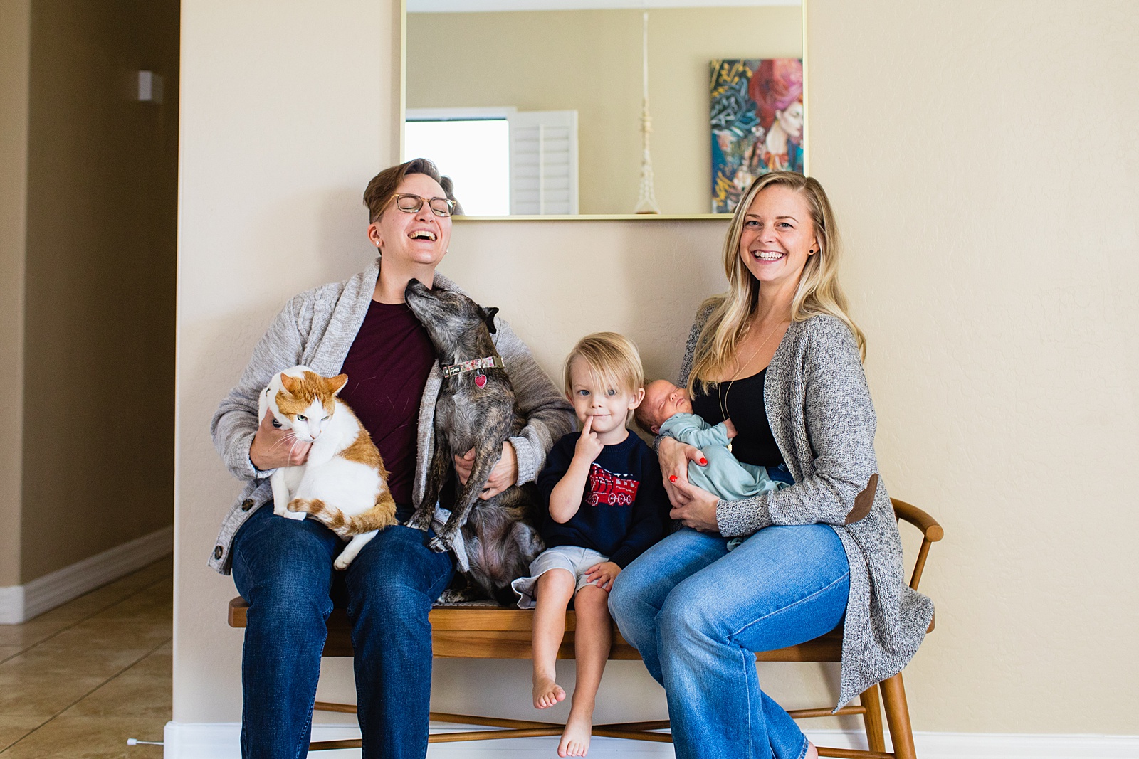 Parents pose with their kids and pets during Phoenix In-Home Newborn session by Arizona wedding photographer Juniper and Co Photography.