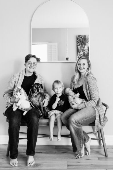 Parents pose with their kids and pets during Phoenix In-Home Newborn session by Arizona wedding photographer Juniper and Co Photography.