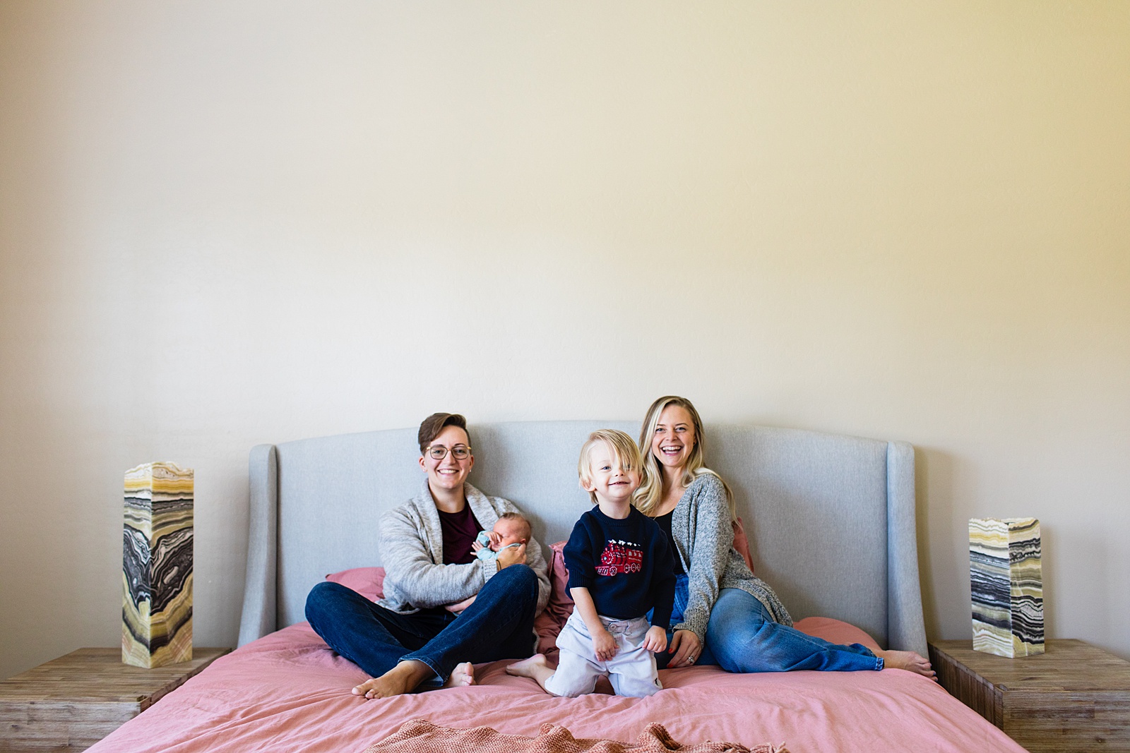 Family poses during Phoenix In-Home Newborn session by Arizona wedding photographer Juniper and Co Photography.