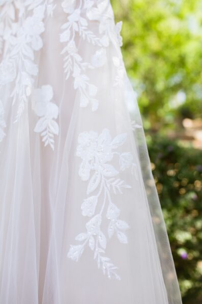 Bride's lace wedding dress details for her Sanctuary wedding by Juniper and Co Photography.
