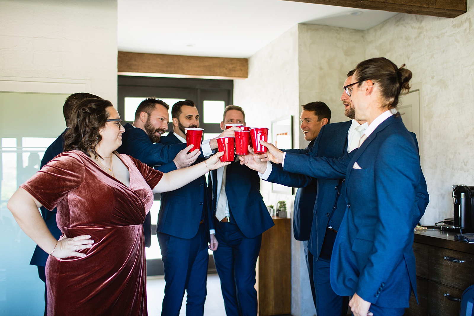 Groom and wedding party together at a Sanctuary wedding by Arizona wedding photographer Juniper and Co Photography.