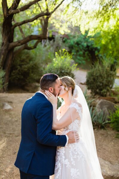 Bride & Groom share a kiss during their Sanctuary wedding by Phoenix wedding photographer Juniper and Co Photography.