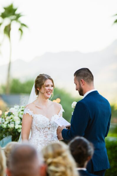 Bride & Groom laughing together during their wedding ceremony at Sanctuary by Phoenix wedding photographer Juniper and Co Photography.