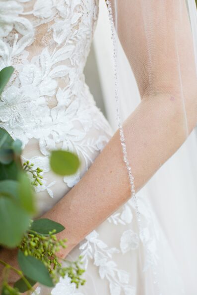 Bride's rhinestone trim lace veil and wedding dress for her Sanctuary at Camelback wedding by Juniper and Co Photography.