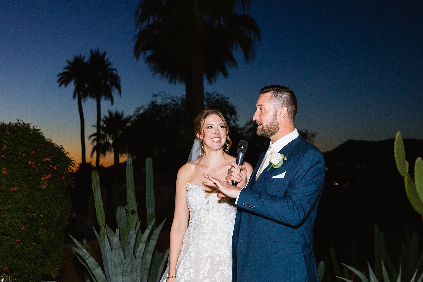 Bride & Groom sharing a toast at their Sanctuary at Camelback wedding reception by Arizona wedding photographer Juniper and Co Photography.
