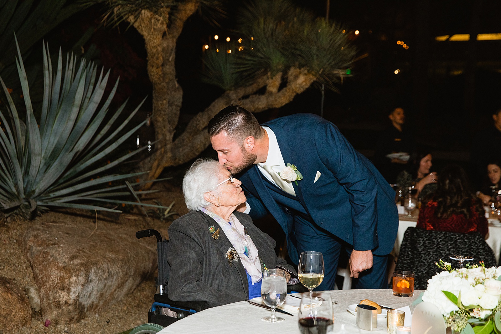 Groom with guests at Sanctuary at Camelback wedding reception by Phoenix wedding photographer Juniper and Co Photography.