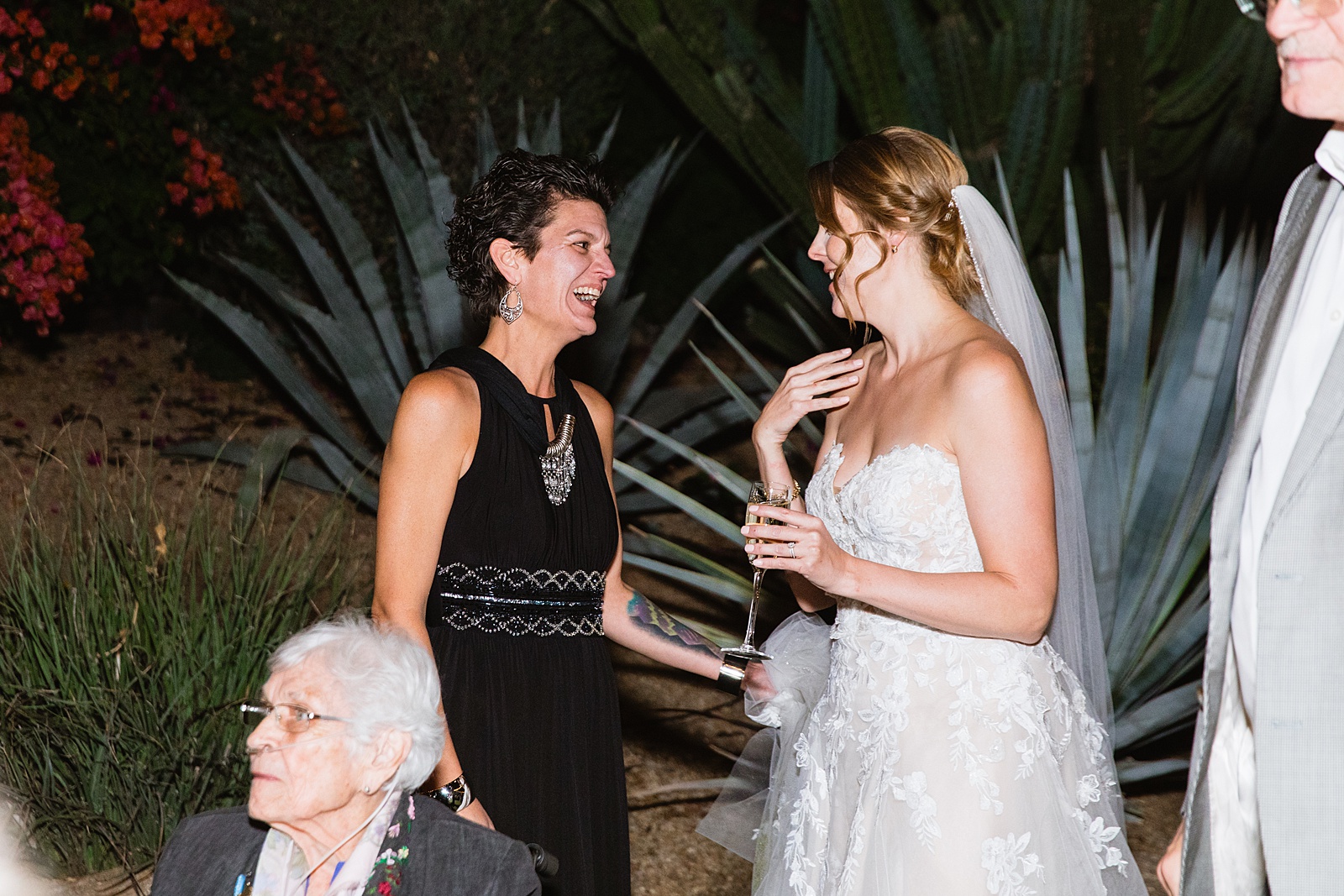 Bride with guests at Sanctuary at Camelback wedding reception by Phoenix wedding photographer Juniper and Co Photography.