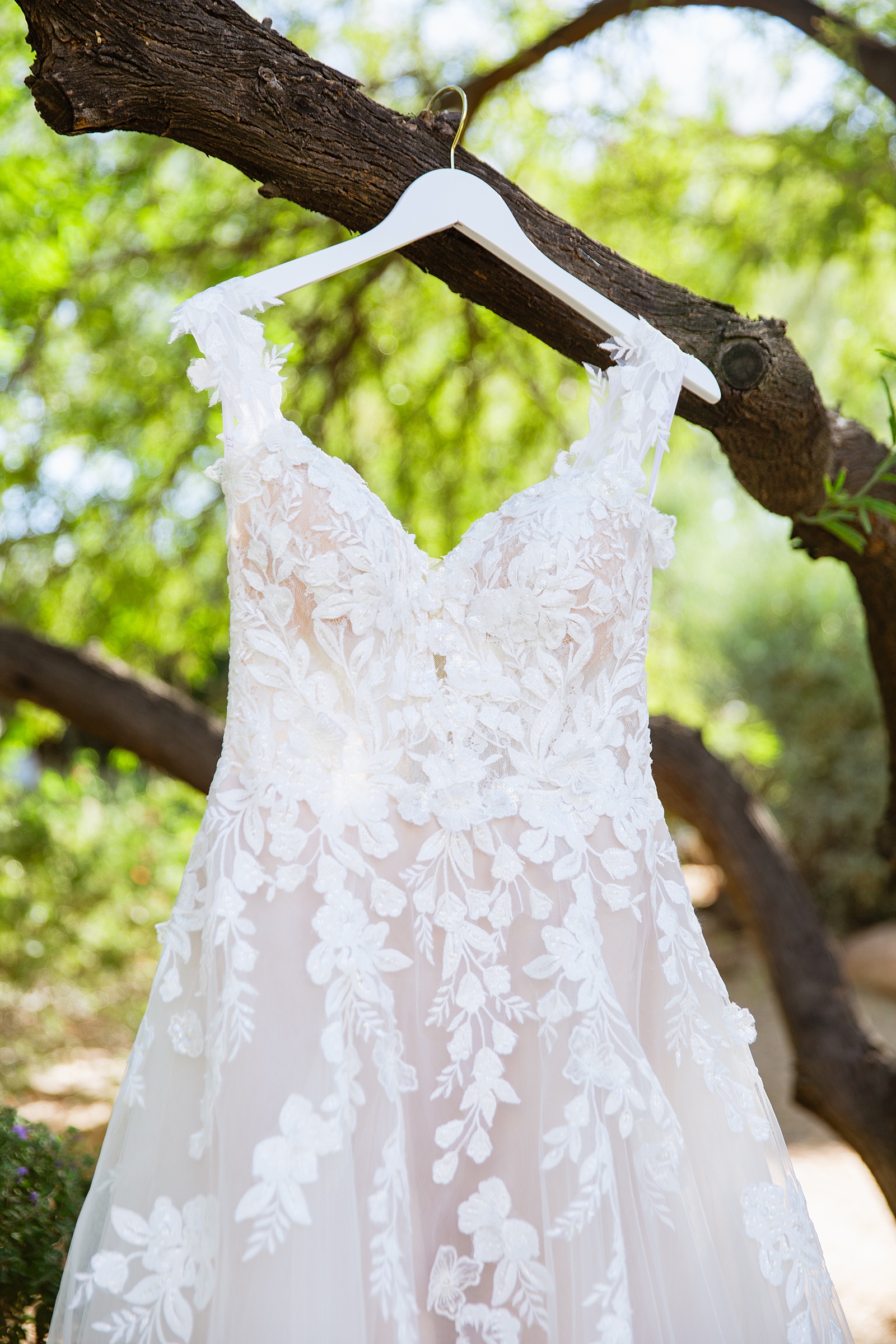 Bride's off the shoulder lace wedding dress for her Sanctuary at Camelback wedding by Juniper and Co Photography.