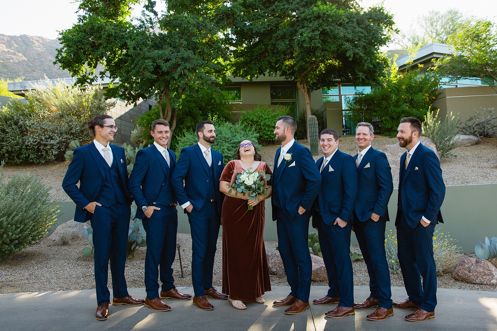 Groom and groomsmen laughing together at Sanctuary at Camelback wedding by Phoenix wedding photographer Juniper and Co Photography.