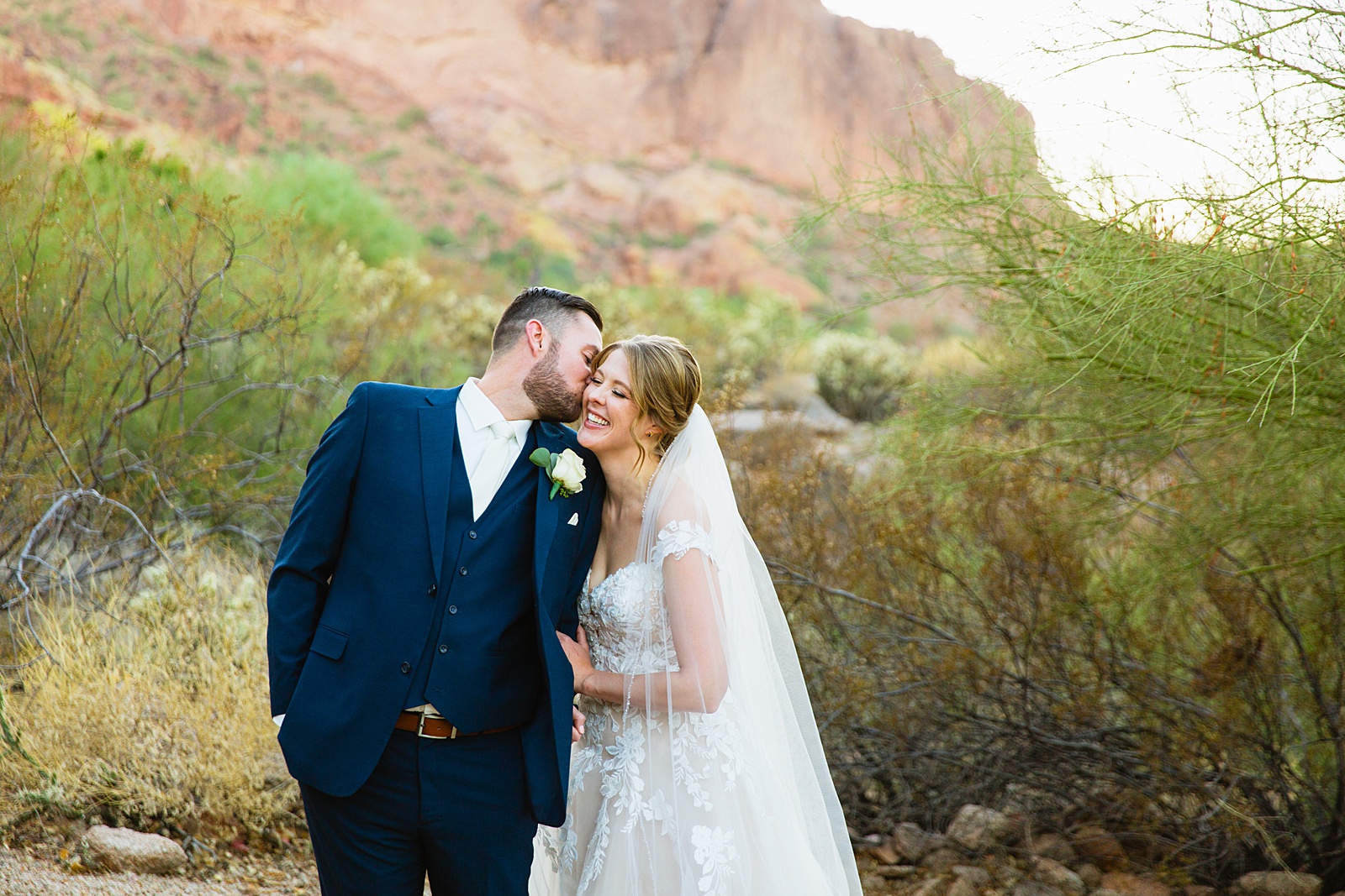 Bride & Groom having fun together during their Sanctuary at Camelback wedding by Phoenix wedding photographer Juniper and Co Photography.