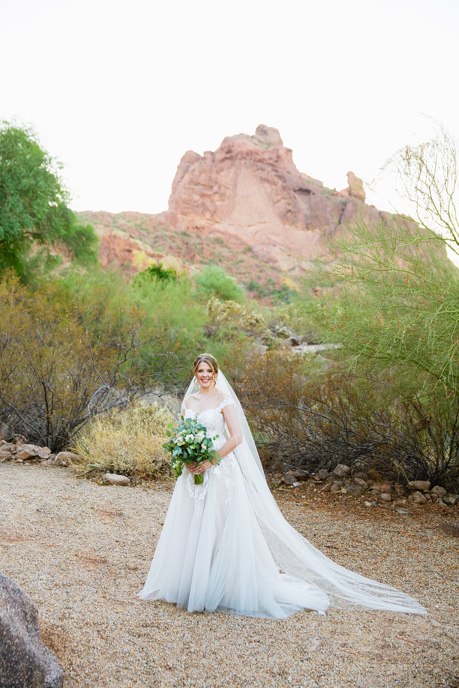 Bride's fairytale off the shoulder wedding dress for her Sanctuary at Camelback wedding by Juniper and Co Photography.